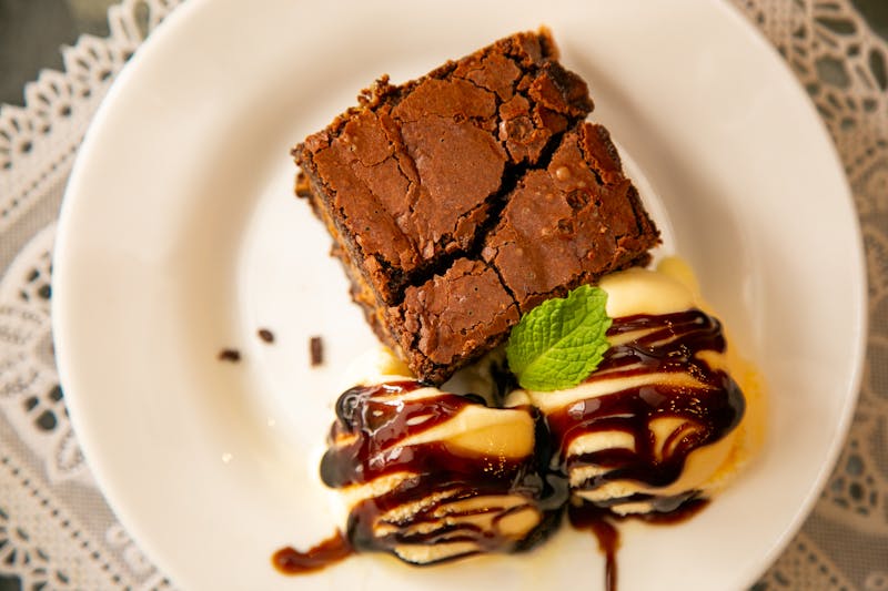 Rich chocolate brownie with vanilla ice cream on top